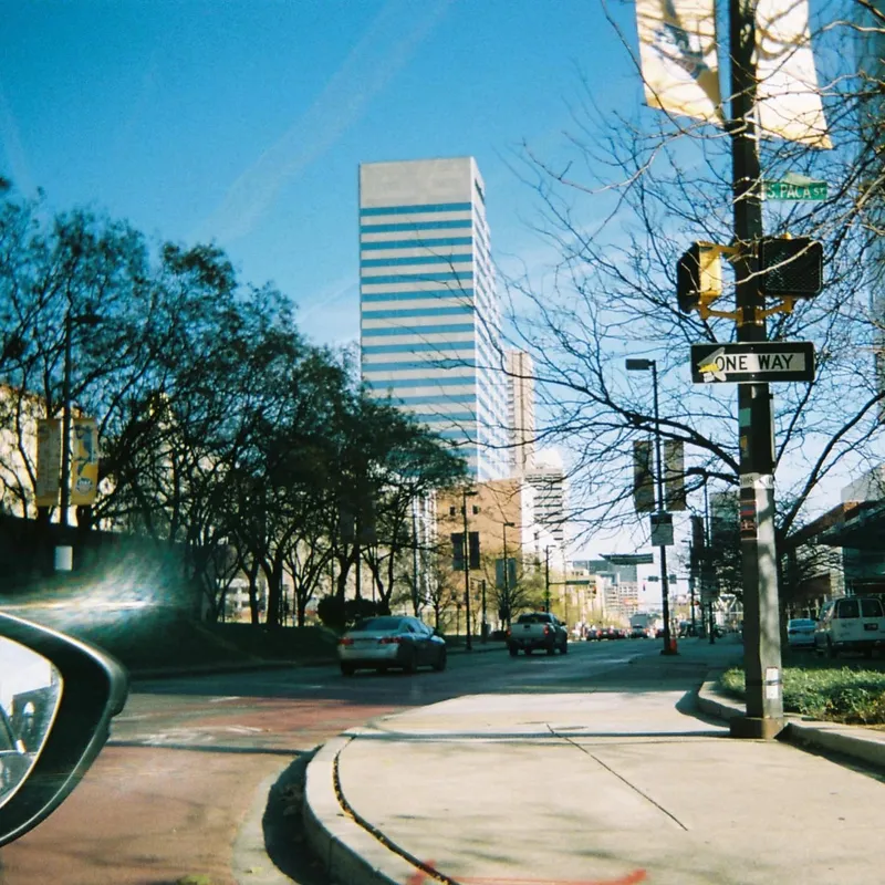 Sun-drenched urban street corner in Baltimore