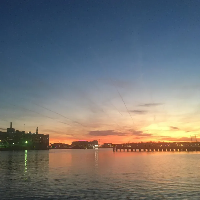 Vibrant orange and blue sunset over the Hudson River